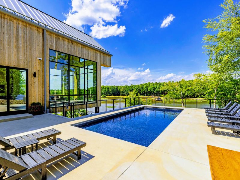 Pool - Open deck space wraps the pool, room to gather or escape the sun.