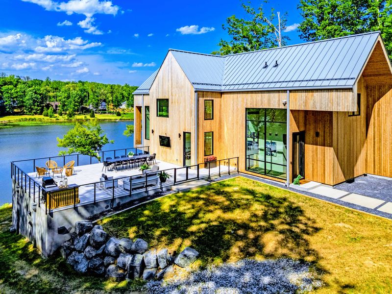 Exterior - The home set into nearly five acres of forest privacy.