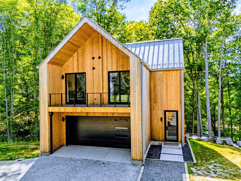 Garage Apartment - A separate two-story cedar retreat with its own entrance and parking.