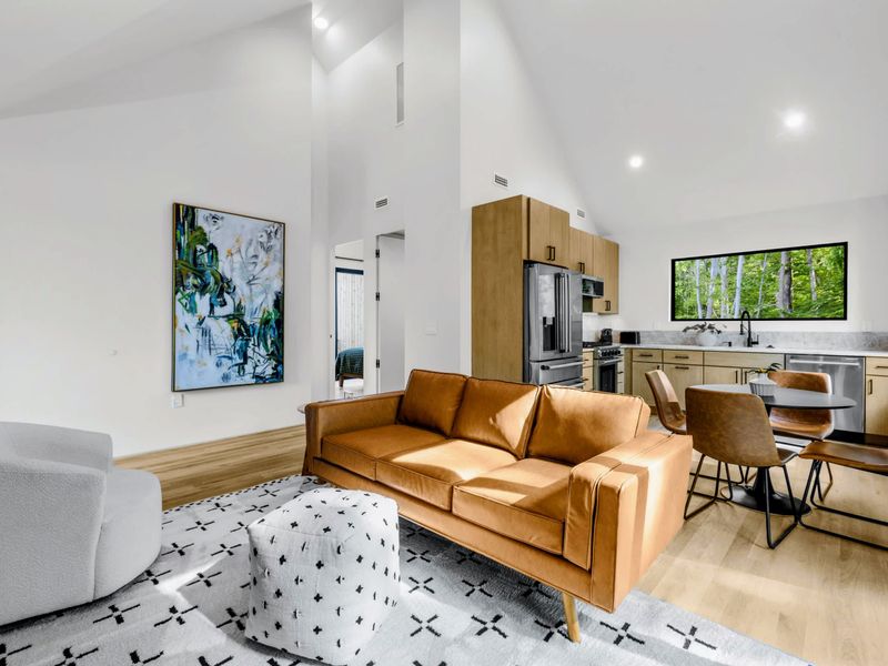 Garage Apartment Living - Open living with soaring ceilings and kitchen for guests who want their own space.