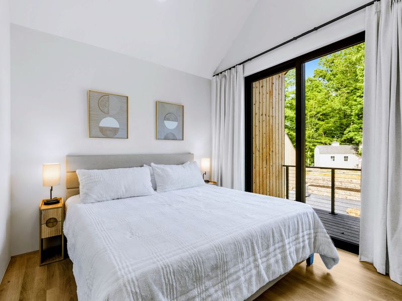 Garage Apartment King - King bed and a private deck door, quiet and away from the main house.