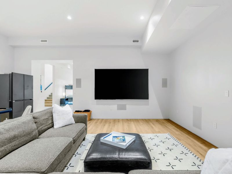 Media Lounge - A big-screen TV and deep sectional turn movie night into an event.