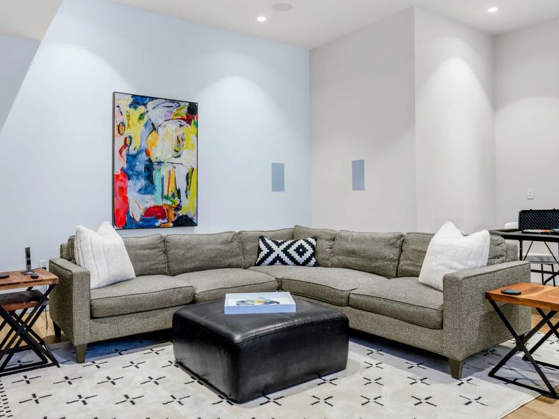 Lower-Level Lounge - Comfortable seating and bold art, a second living room downstairs.