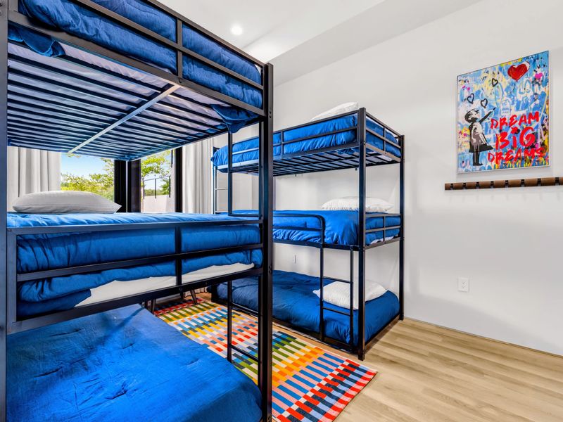 Bunk Room - Bright bunks and playful art, built for the under-12 headquarters.