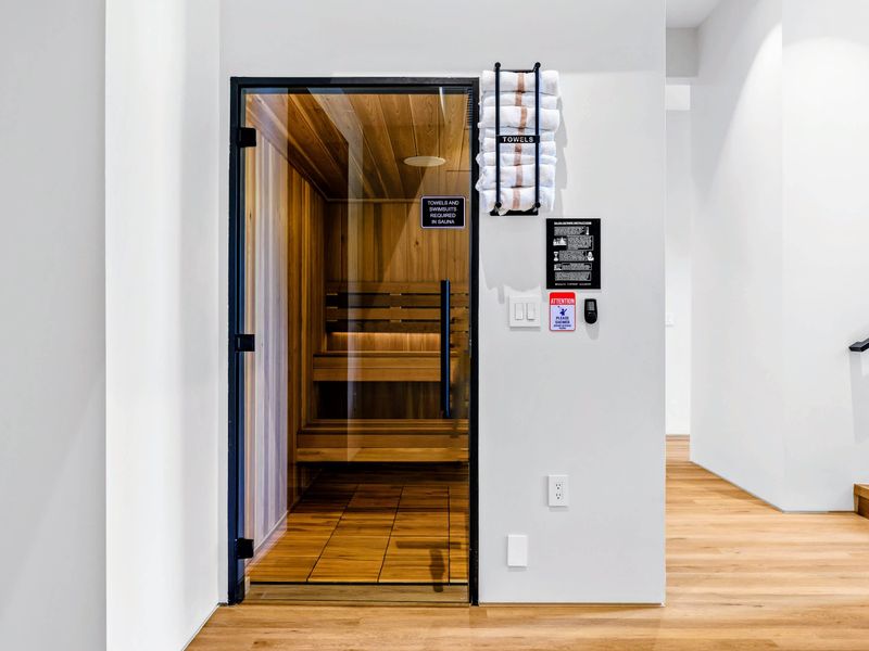Sauna Entrance - The cedar sauna sits just off the lower-level lounge and stairs.
