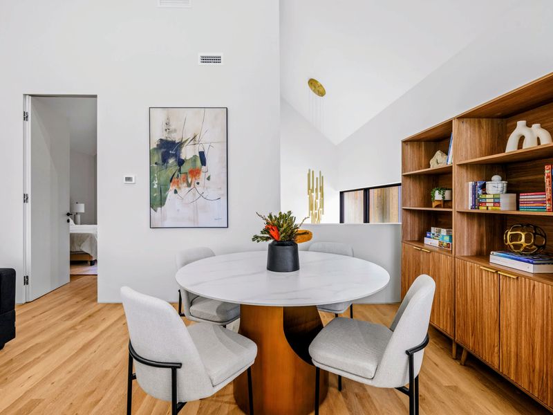 Loft Lounge - Bookshelves, art, and a reading table in the quiet upstairs retreat.