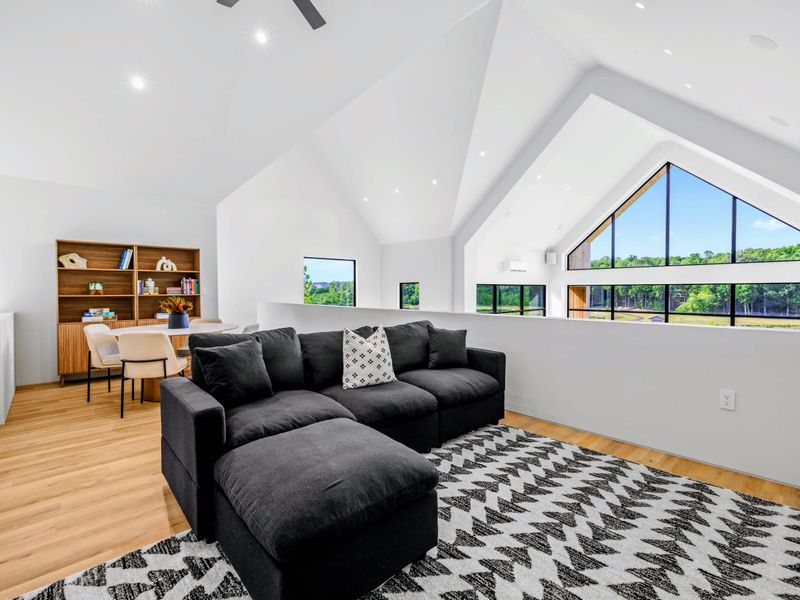 Loft Lounge - Treetop views and soft light make this the calm corner of the house.