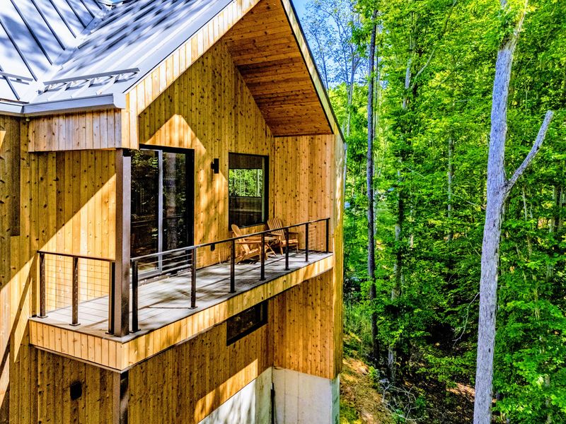 Garage Apartment Balcony - Chairs tucked into the treetops for coffee and forest views.