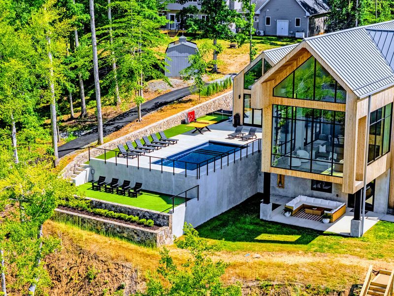 Aerial View - Pool, dock, and decks in a single overhead frame.