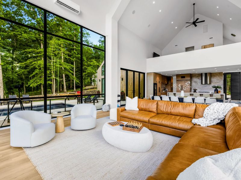 Great Room - Sculptural boucle chairs and clean Nordic lines, the lake always in view.