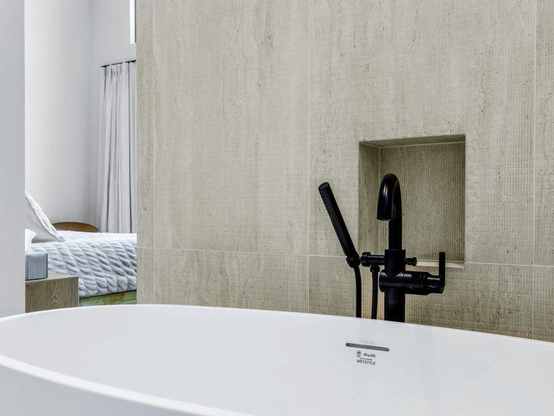 Primary Bath - The freestanding soaking tub is a destination of its own.