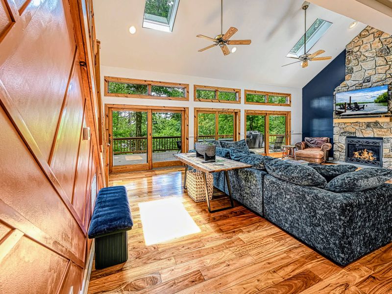 Stone Fireplace - A floor-to-ceiling stone fireplace anchors the great room with warmth and character.