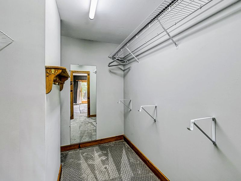Walk-In Closet - Generous closet space in the primary suite keeps luggage off the floor and everything in reach.