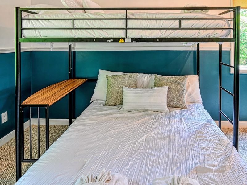 Bunk Detail - The lower bunk is a full-size bed with a fold-down desk alongside, room for a few more to sleep.