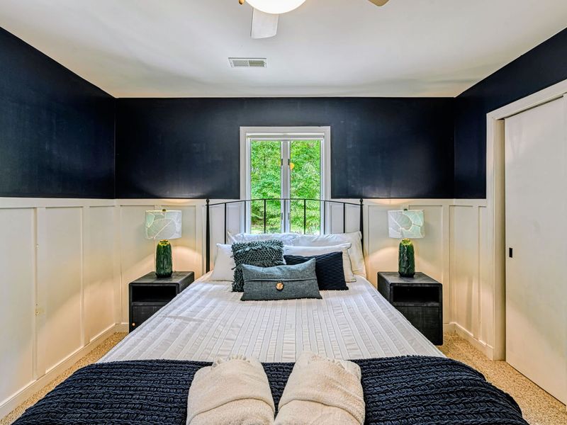 Restful Quarters - Crisp linens, woods views, and matching nightstand lamps make for easy nights.