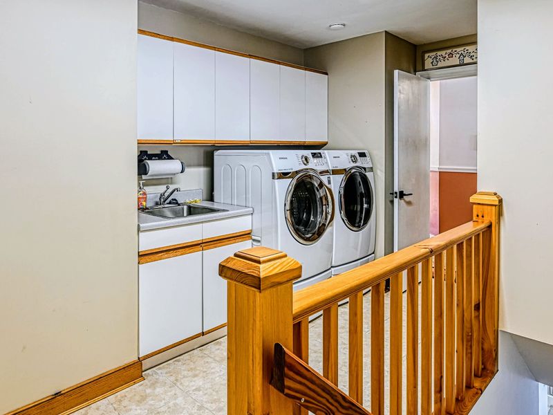 Laundry Room - A full-size front-load washer and dryer make longer stays easy.
