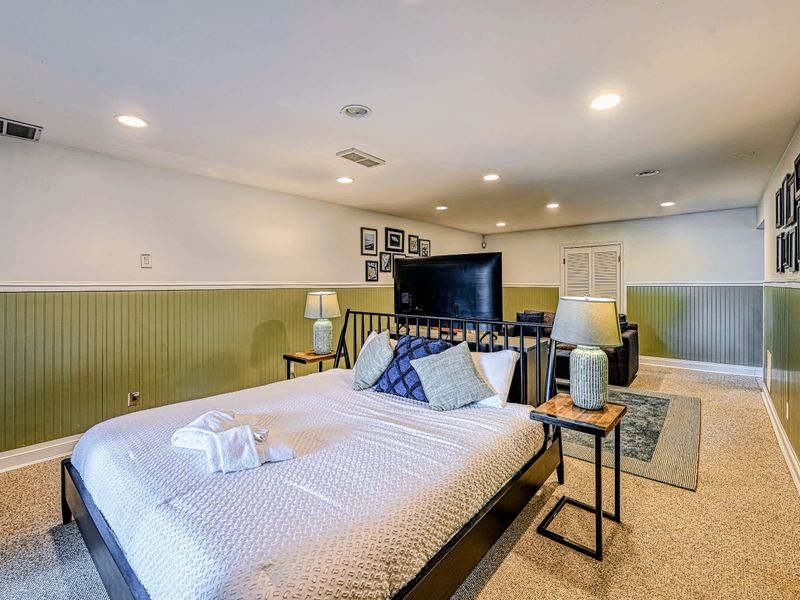 Flexible Space - A king bed and pull-out sofa here add comfortable extra sleeping when the group grows.