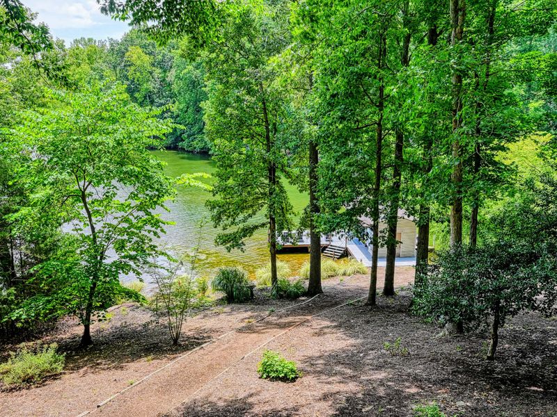 Lake Through the Trees - Glimpses of the cove filter through the woods from the back of the home.