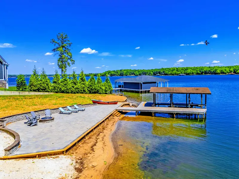 Dock - Out on the water with the home framed behind, the quiet warm side of Lake Anna all around.