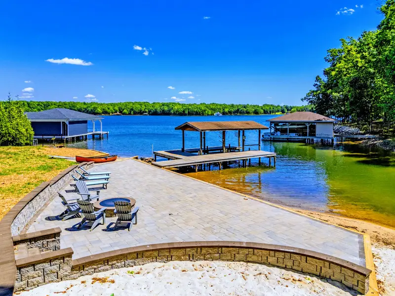 Dock - A covered boat lift and tie-up space put the whole lake within easy reach of the house.