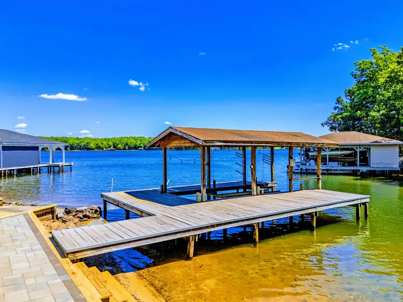 Dock - Your morning starts here: coffee in hand on the dock, the lake still and golden before the boats come out.