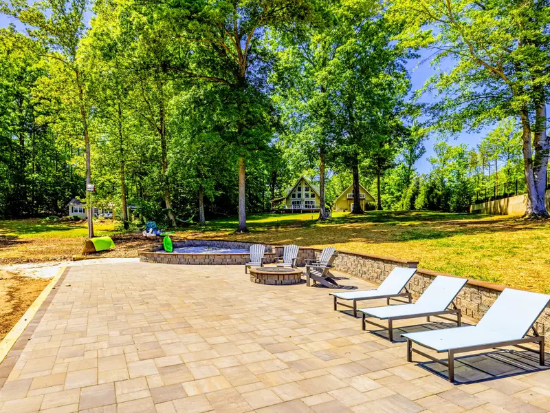 Backyard & Beach - Sand, lounge space, and open water, the outdoor heart of the stay.