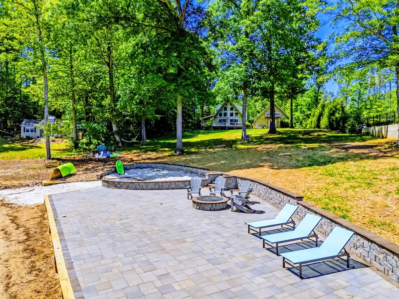 Backyard & Beach - A paver patio with lounge chairs, the perfect spot to dry off between swims.