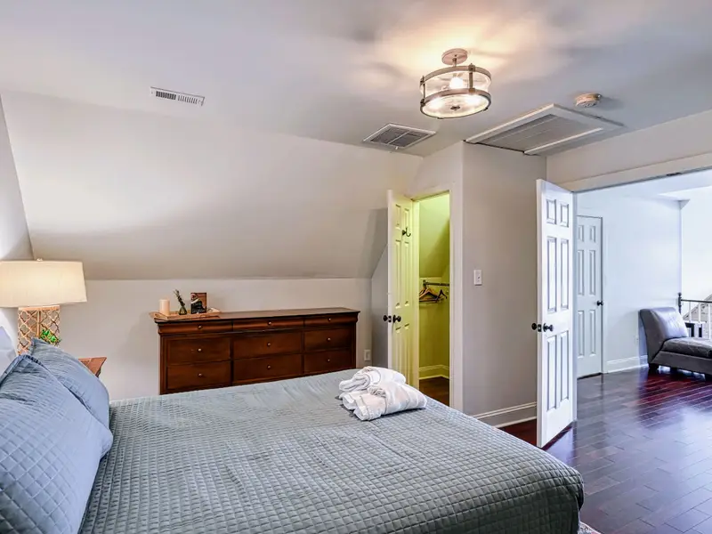 Primary Suite - The private upstairs suite pairs with an en-suite featuring a walk-in shower and clawfoot tub.