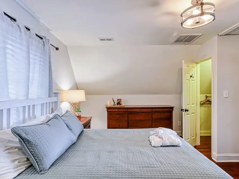 Primary Suite - Quiet and tucked under the eaves, with room to truly unwind.