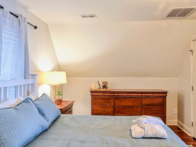 Primary Suite - A queen bed and calm, light-filled space, the reward at the end of a full lake day.