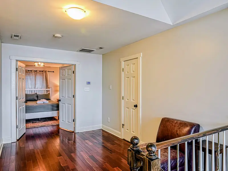 Primary Suite - A queen bed and calm, light-filled space, the reward at the end of a full lake day.