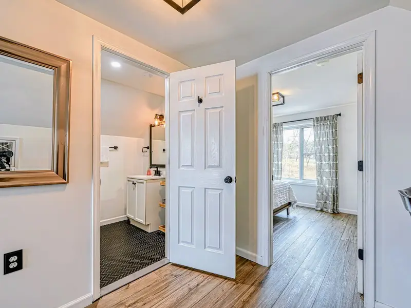 Guest Suite - A self-contained retreat connected by its own hallway, separate from the main house.