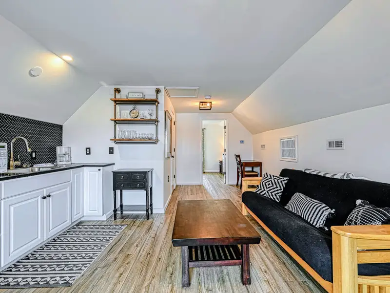 Guest Suite - A private suite above the garage with its own living area and kitchenette, ideal for extra privacy.