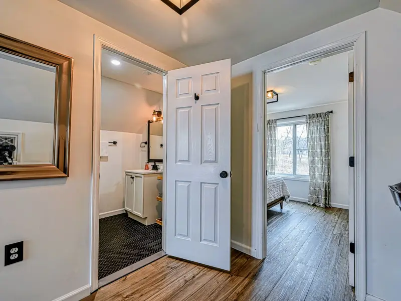 Guest Suite - The suite opens between its living space, bath, and bedroom for easy private living.