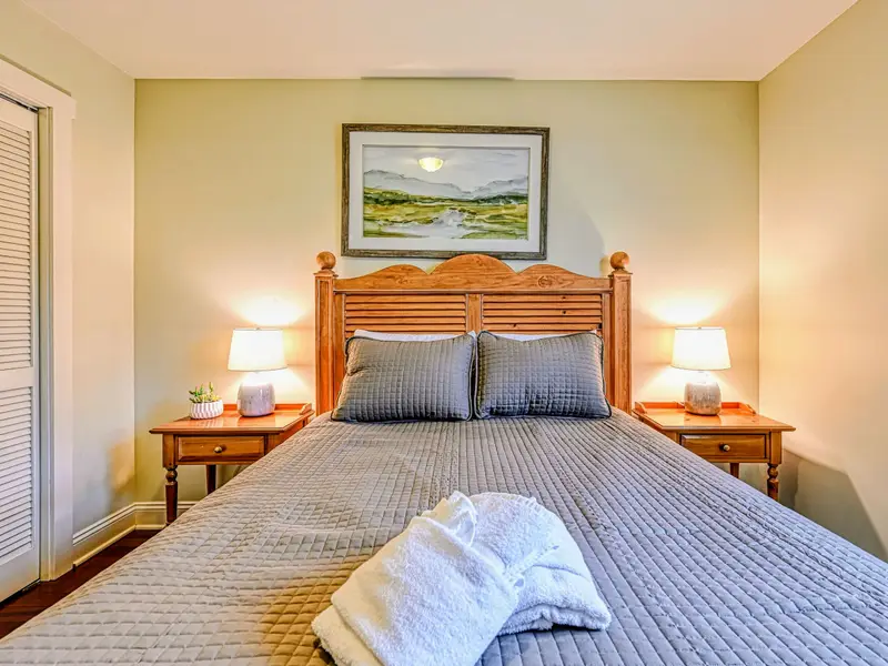 Bedroom 2 - Simple, serene, and comfortable, with room to relax.