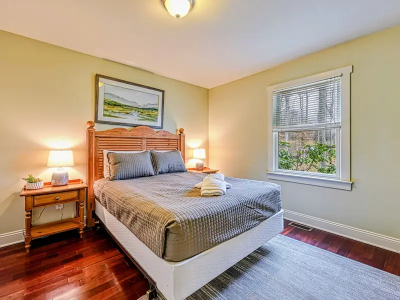 Bedroom 2 - A comfortable main-level queen, bright and easy to settle into.