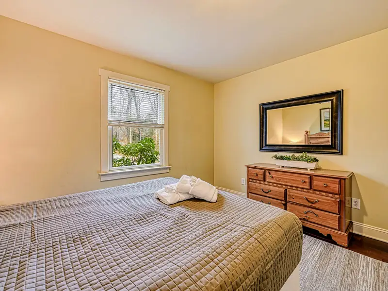 Bedroom 2 - Soft bedding and good light make this main-level room a restful retreat.