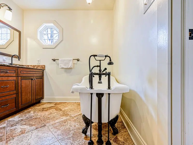 Bathroom - A clean, full bath with a soaking tub and walk-in shower for unwinding after the lake.