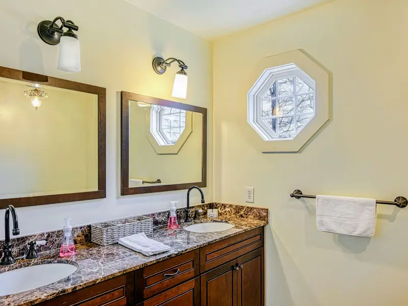Bathroom - Double vanity and granite counters keep busy mornings moving smoothly.