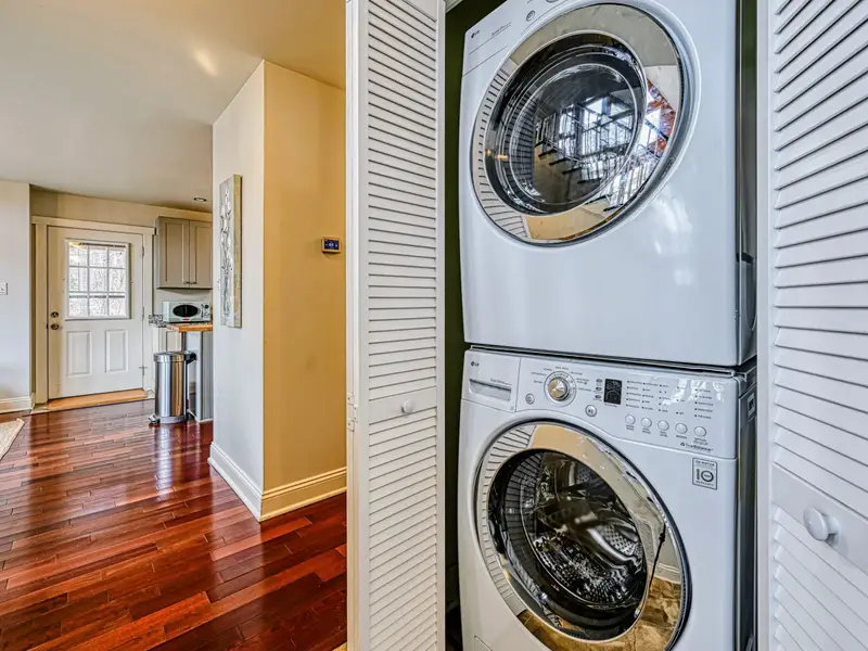 Laundry - A full-size stacked washer and dryer make longer stays easy.