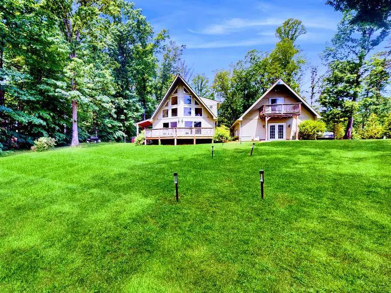 Aerial View - The home, lawn, and waterfront from above, showing just how close the lake really is.