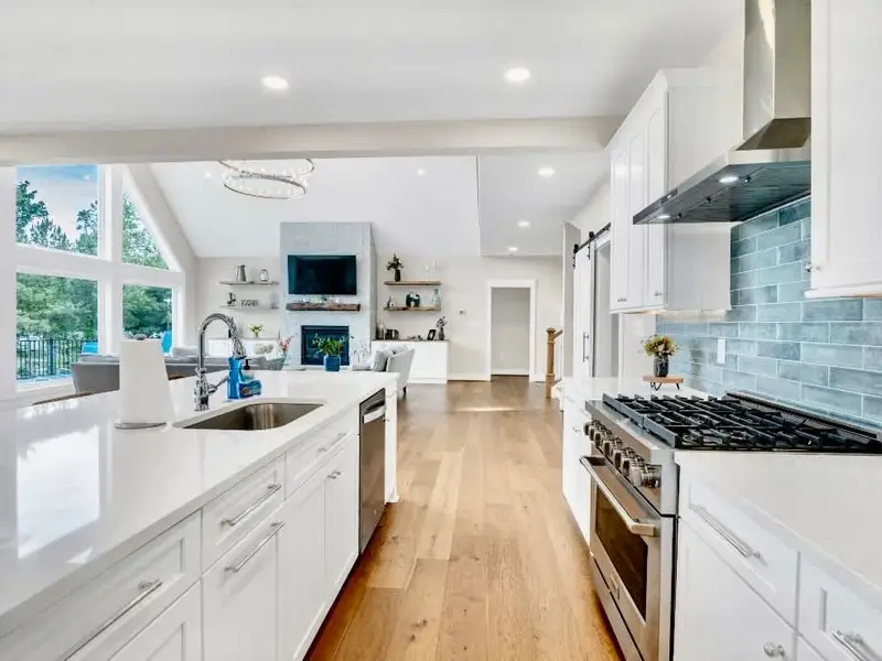 Kitchen -Welcome to our modern gourmet kitchen, featuring a high-end gas range, quartz countertops, a stunning 10-foot island, and all the amenities needed to create memorable meals &  moments together. Check out all the details in the following pics