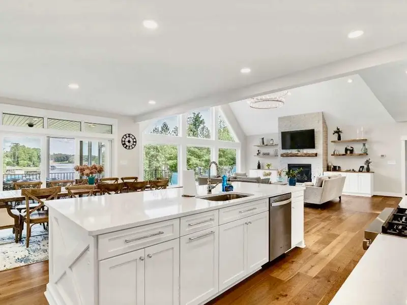 Those lake views from every room! It never gets old!  Whether dining at the kitchen island, or on the Restoration Hardware dining table or on the screen porch, party deck or the great room wall of windows - it's big water views - all day long!!