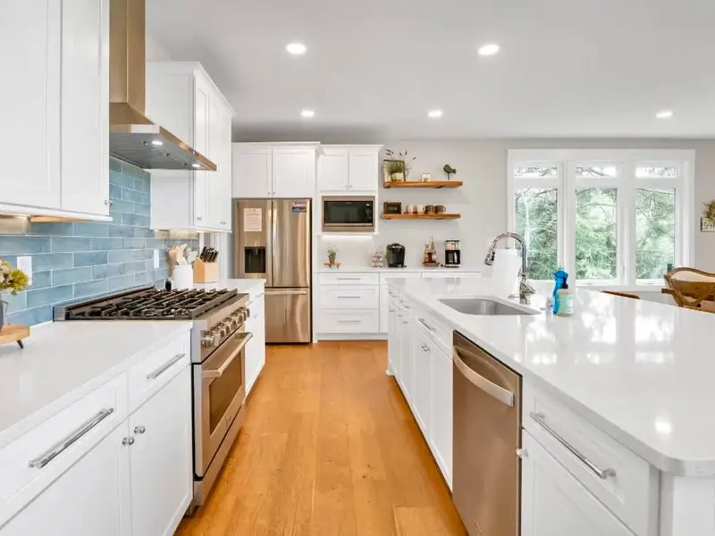 Guests will love to gather in this gourmet kitchen, stocked with high-end cookware and every essential you could need. Don't miss the impressive walk-in pantry! With breathtaking lake views and a spacious island  this kitchen is a chefs dream!