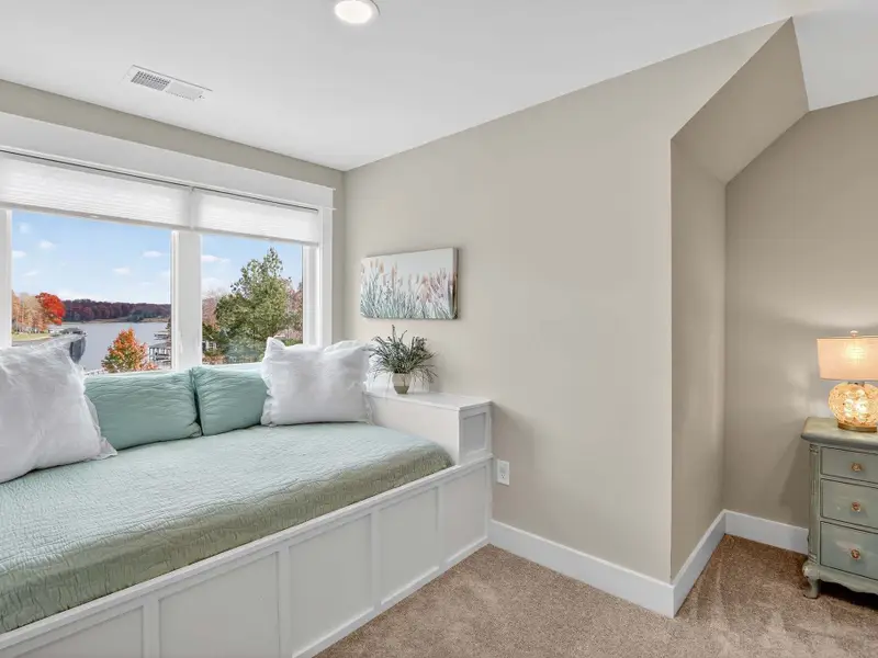 Our custom built-in full size beds with teal bedding & lake views offers a cozy reading nook & amazing lake views, but BEST of all a full size bed for kids. We provide extra bedding/sheets/pillows for these beds and the mattresses are very cozy!