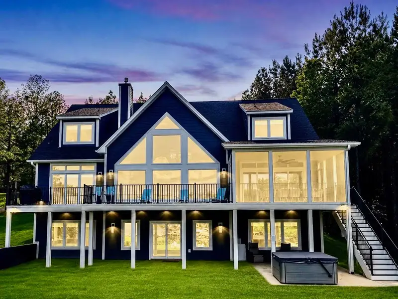 At sunset, Blueberry Bay transforms into a glowing lakeside escape, with three expansive levels illuminated for unforgettable evenings of connection, comfort, and luxury.