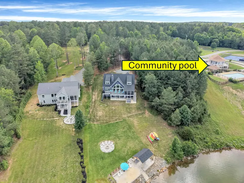 This aerial shot shows Blueberry Bay and the proximith to the pool, tennis courts/pickleball/clubhouse.  Guests just exit the driveway and walk to the next driveway entrance to the clubhouse entrance.