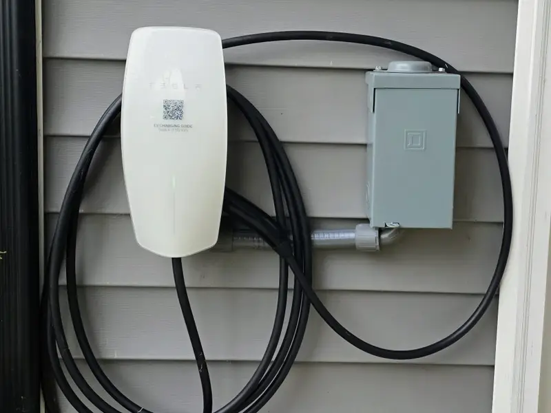 EV Charging - A Tesla Universal Wall Connector is mounted at the home, ready to charge your Tesla or other EV during your stay.