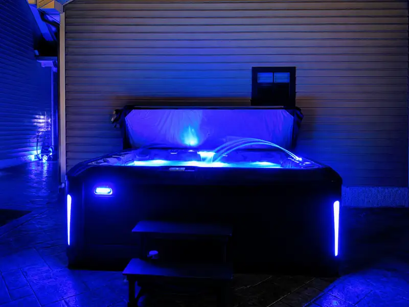 Hot Tub - LED-lit and glowing blue under the stars, built for long soaks on cool evenings.