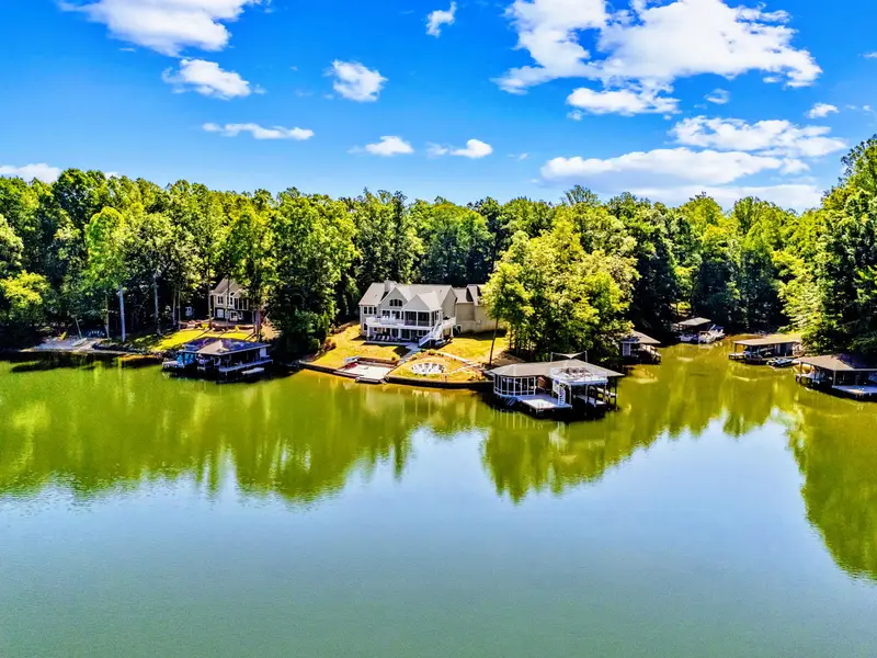 Aerial View - Tucked into a wooded cove on the quiet side of Lake Anna, with calm, open water just off the dock.